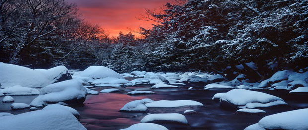 Snowy River at Sunset Snowy rocks accent a river in a New Hampshire forest at sunset